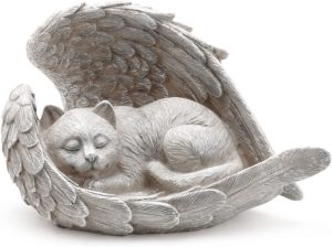 Statue of a sleeping cat with wings of an angel